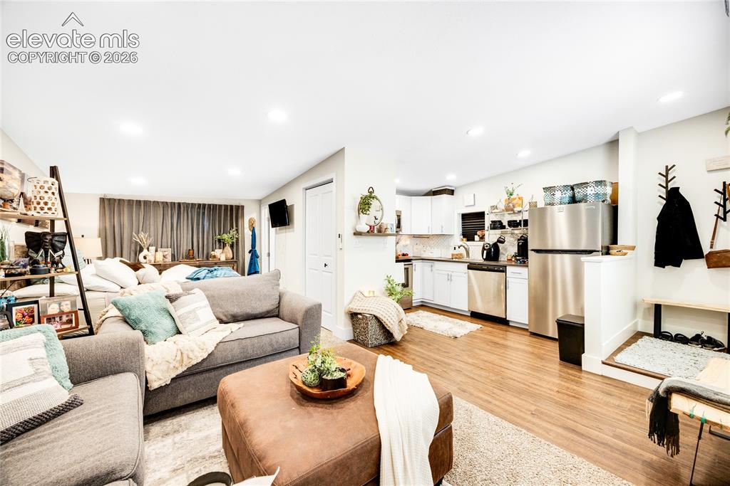Image 26 of 33: ADU/Cottage - Open-concept living area featuring wood-finish flooring, rece