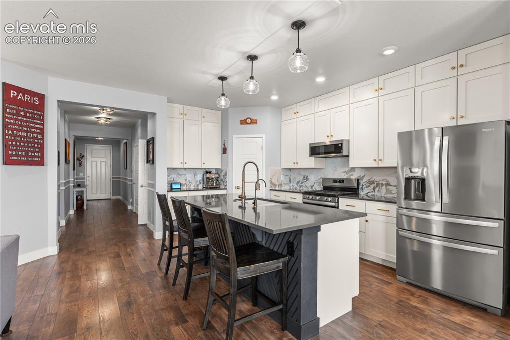 Image 12 of 41: Stainless Appliances and a Chevron Island are just the tip of the iceberg h