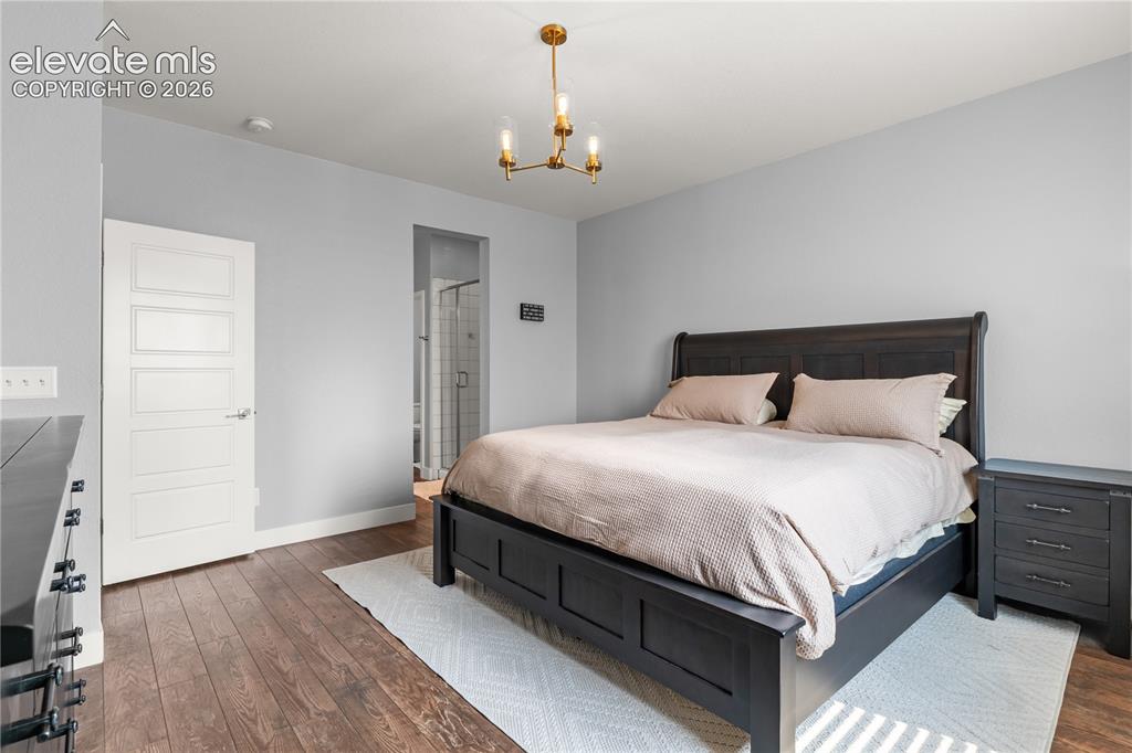 Image 15 of 41: The main level primary is a luxurious spa retreat.