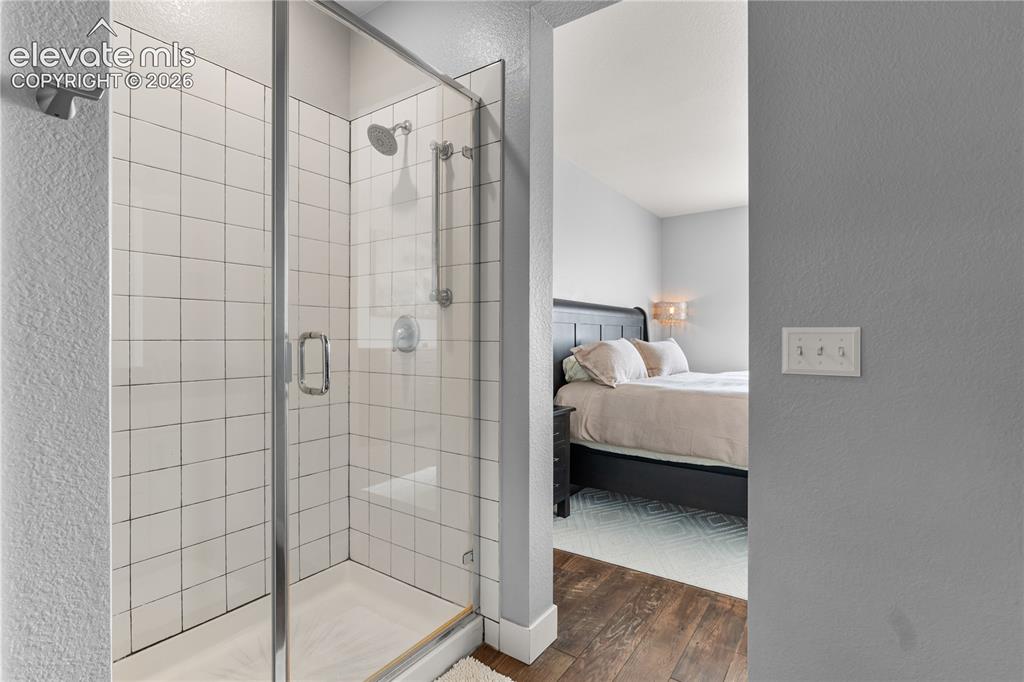 Image 18 of 41: Subway tile shower.
