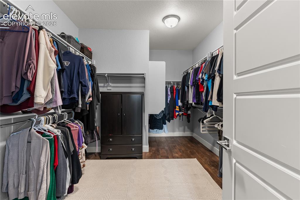Image 19 of 41: The huge master closet.