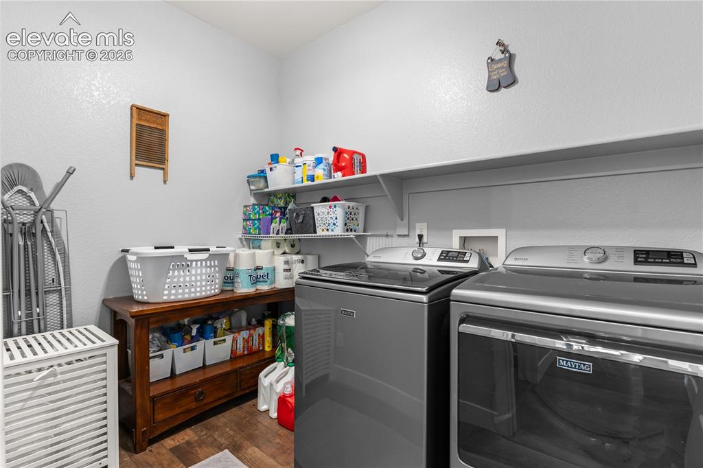 Image 23 of 41: Main level laundry makes this chore convenient.