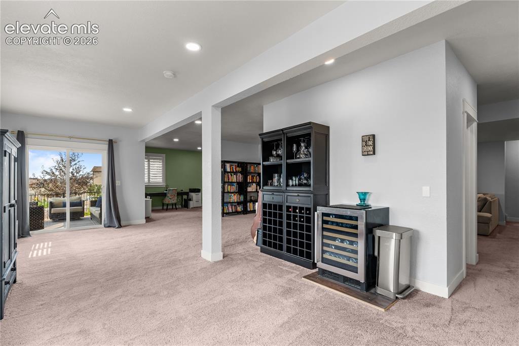 Image 28 of 41: Could accomodate game tables and more. The tall ceilings are bright and ai