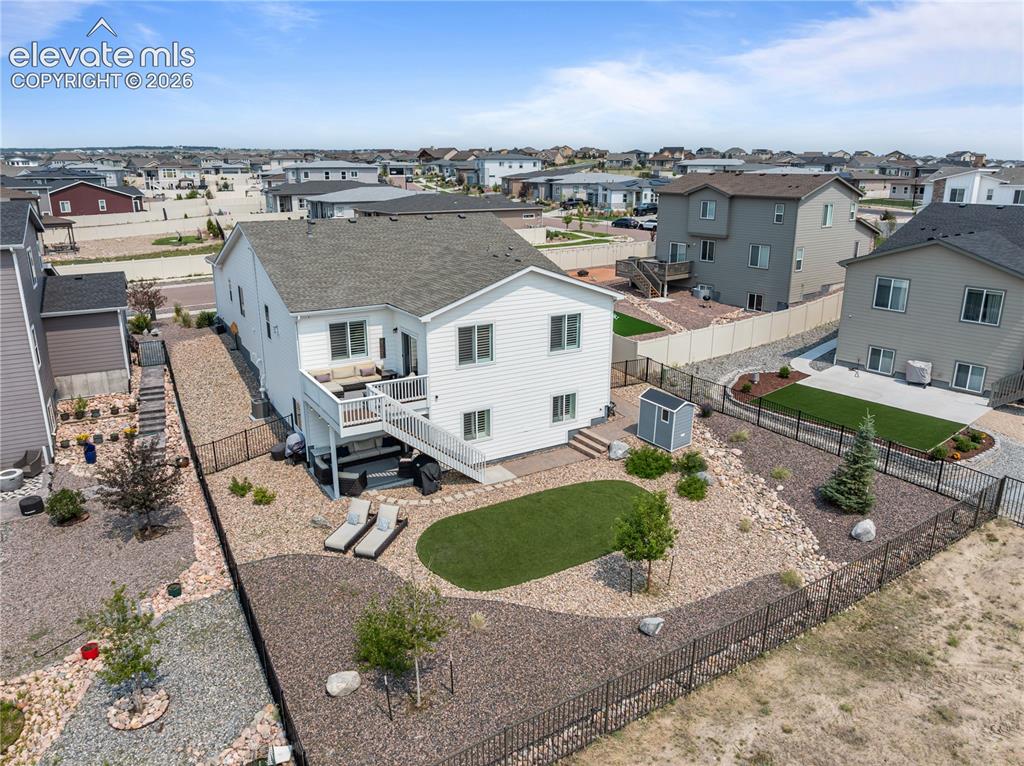 Image 4 of 41: Turf in the rear, upper and lower level outdoor spaces, walkout basement, a