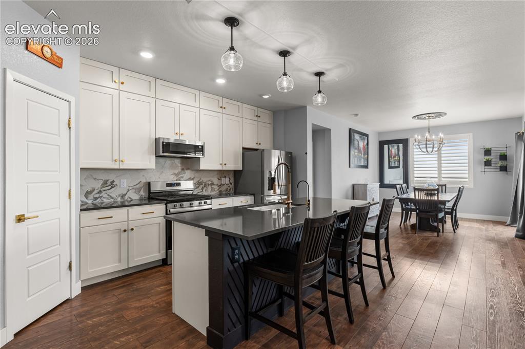 Image 8 of 41: Gas fireplace is the heart of the home.