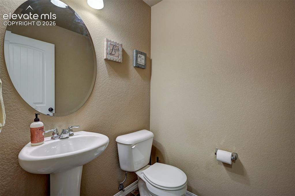Image 5 of 42: guest 1/2 bath main floor 