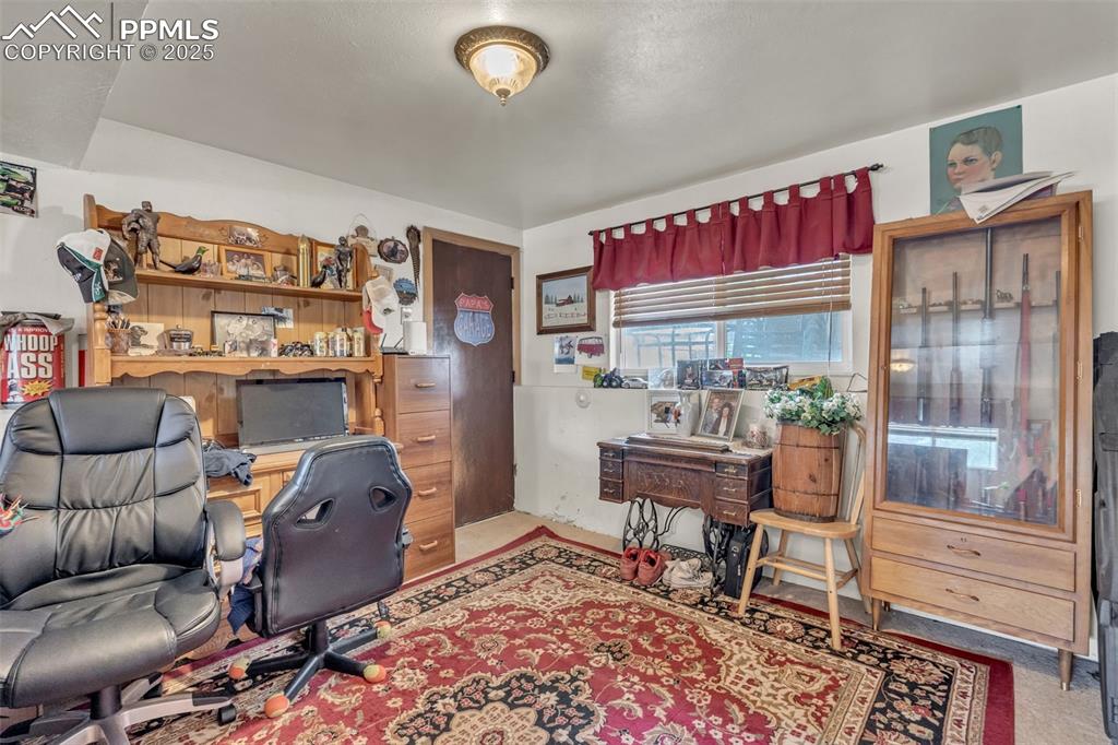 Image 11 of 49: Extra space in spacious family room.