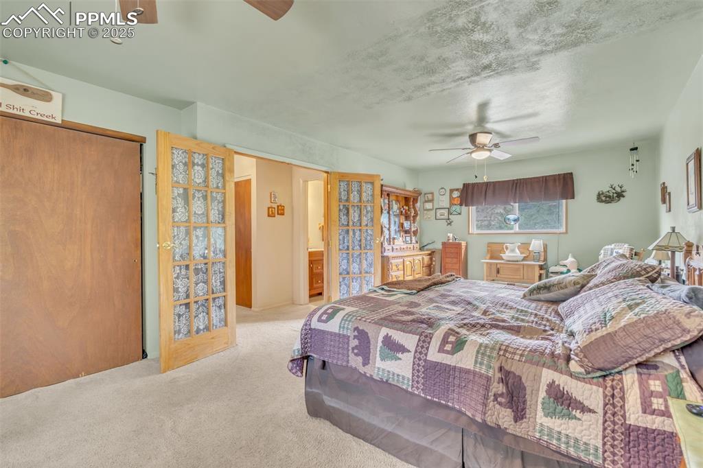 Image 15 of 49: Bedroom featuring carpet flooring, ceiling fan, and a closet