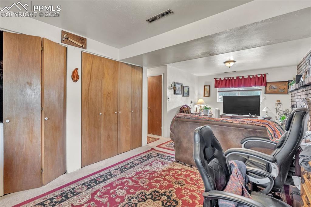 Image 17 of 49: Office area with carpet floors