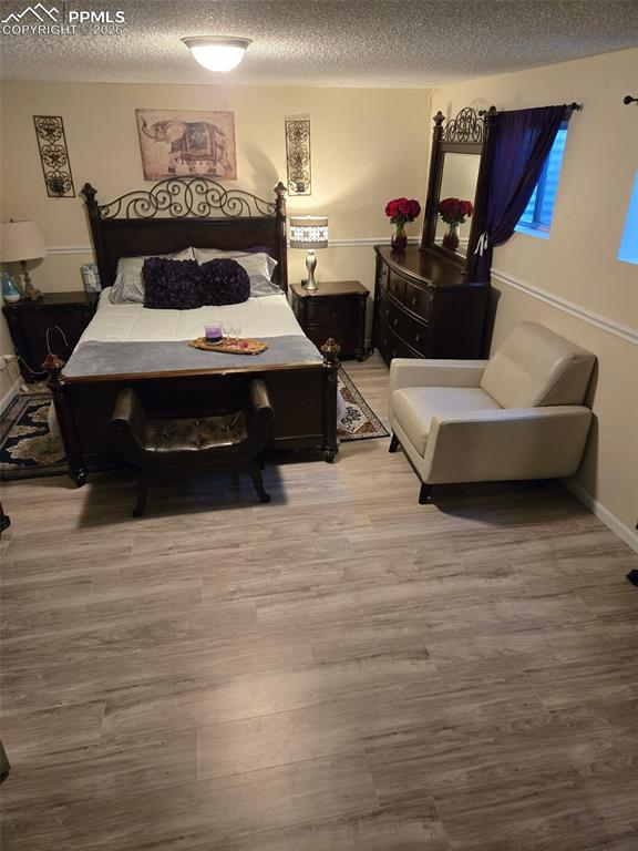 Image 25 of 33: Downstairs family room converted to a 5th bedroom