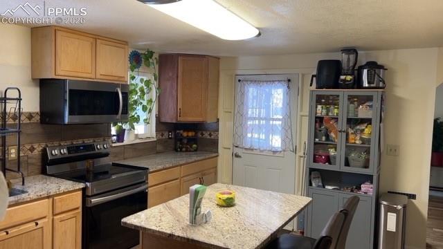 Image 6 of 35: Side view of the remodeled kitchen