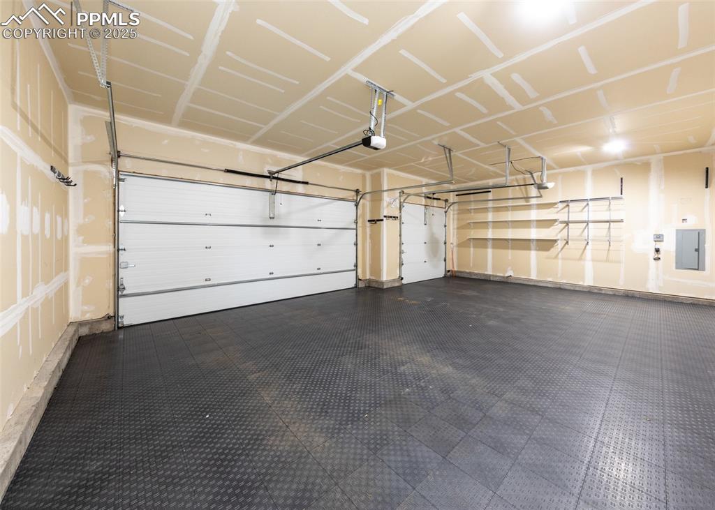 Image 33 of 40:  insulated & finished 3 car attached garage with service door & floating sa