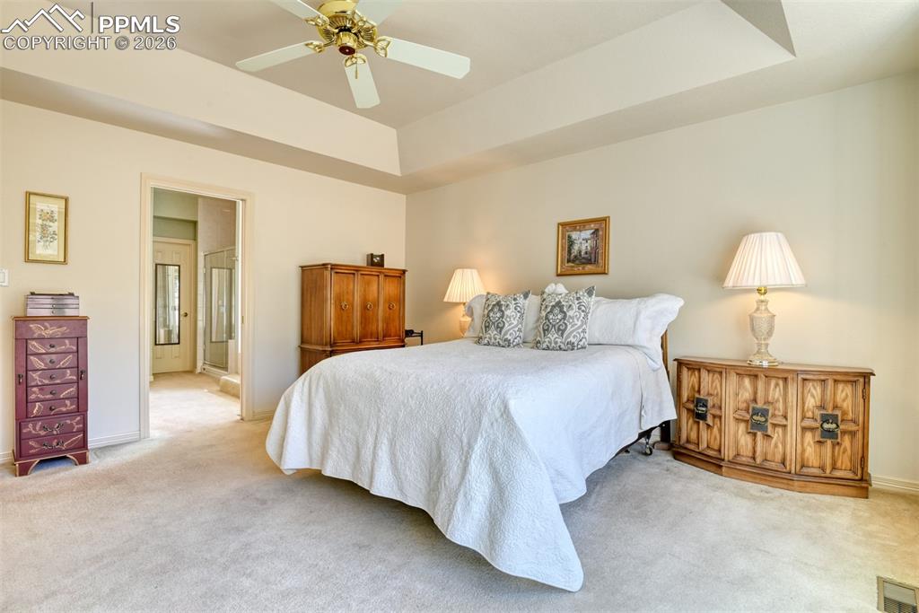Image 19 of 47: View looking toward the primary bathroom with soaking tub and massive walk-