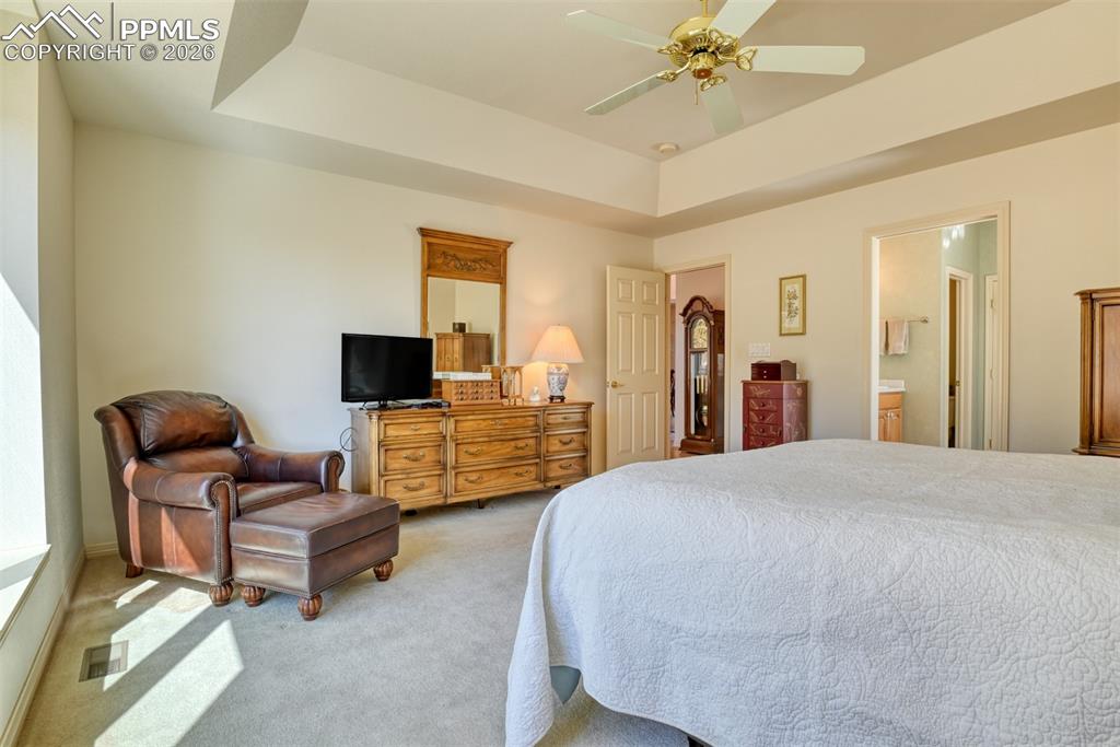 Image 20 of 47: Another view of the primary bedroom