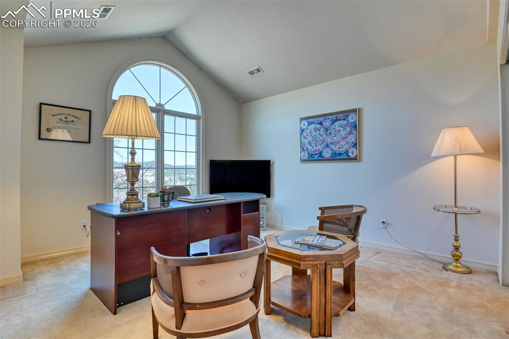 Image 33 of 47: Upstairs bedroom #3 is being used as an office and overlooks the front yard