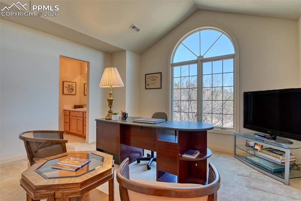 Image 34 of 47: Office connects to shared Jack and Jill bathroom.