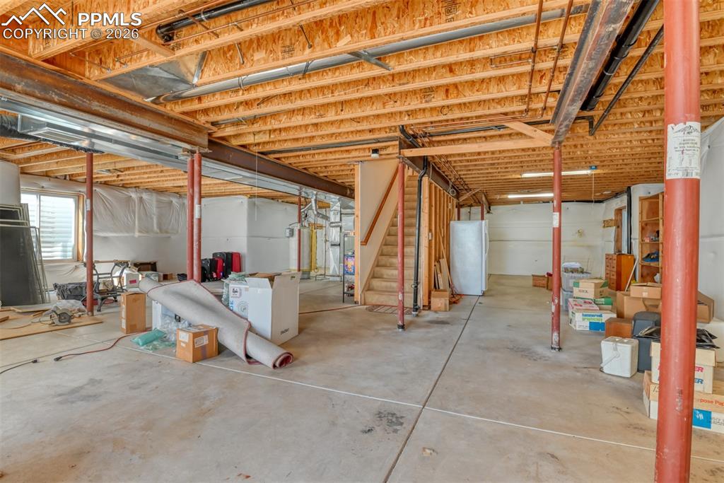 Image 41 of 47: Unfinished basement provides room for expansion or warm space for children 
