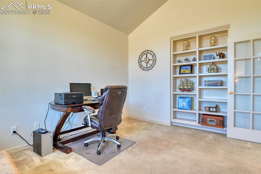 Image 7 of 47: Office has adjustable built-in shelves. 