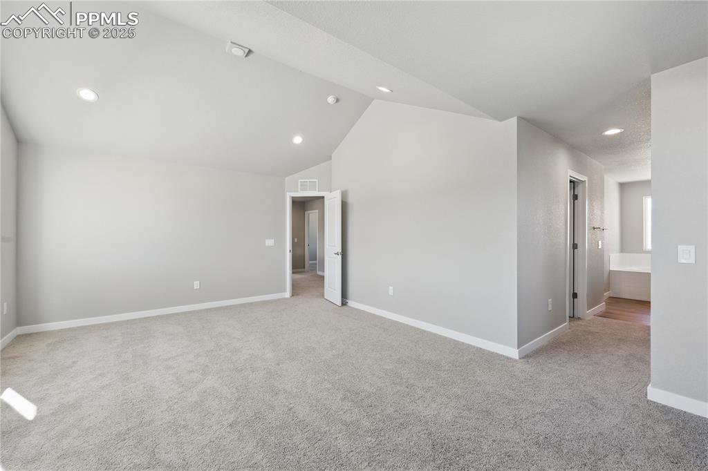 Image 21 of 36: Spare room featuring recessed lighting, visible vents, light carpet, basebo