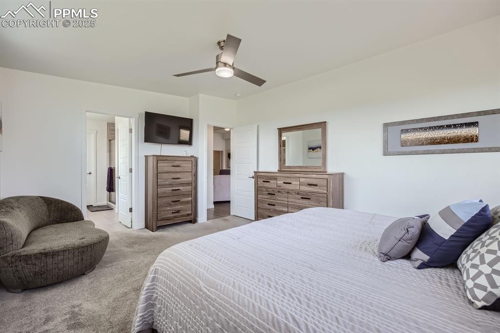 Image 11 of 31: Bedroom featuring carpet flooring and ceiling fan