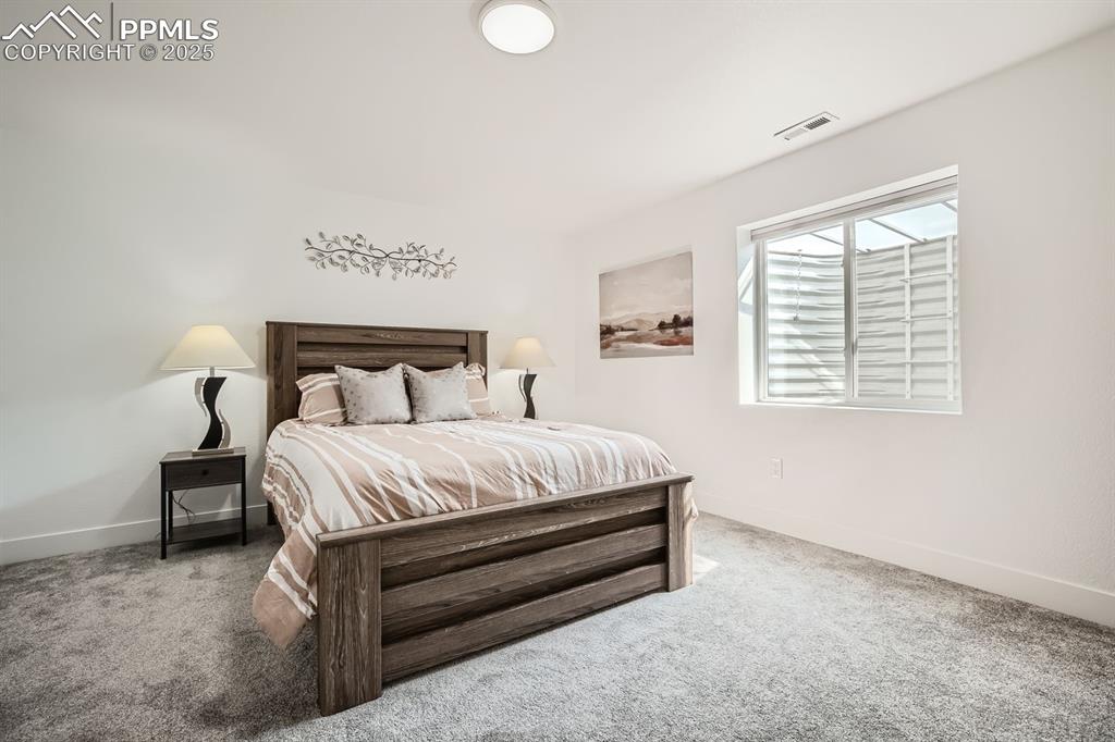 Image 24 of 31: Bedroom featuring carpet floors and baseboards