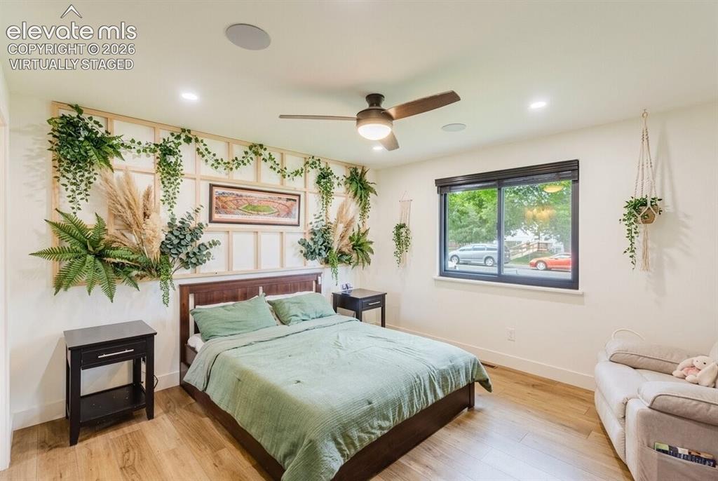 Image 10 of 49: Wood-finish flooring with recessed lighting and a ceiling fan (virtually st