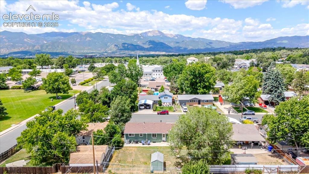 Image 26 of 49: Aerial perspective showcasing a residential neighborhood with distant mount