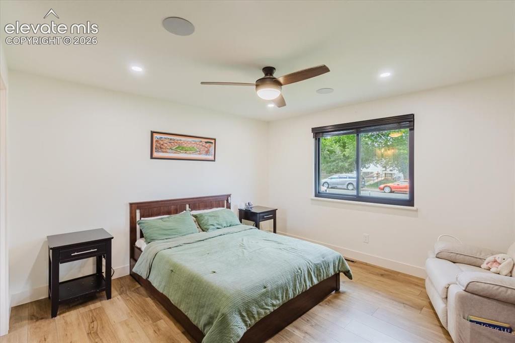 Image 36 of 49: Bright room featuring recessed lighting, a ceiling fan with integrated ligh