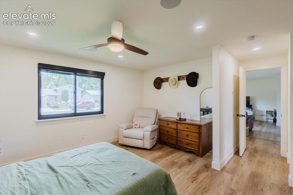 Image 37 of 49: Interior room featuring wood-finish flooring and light-toned walls