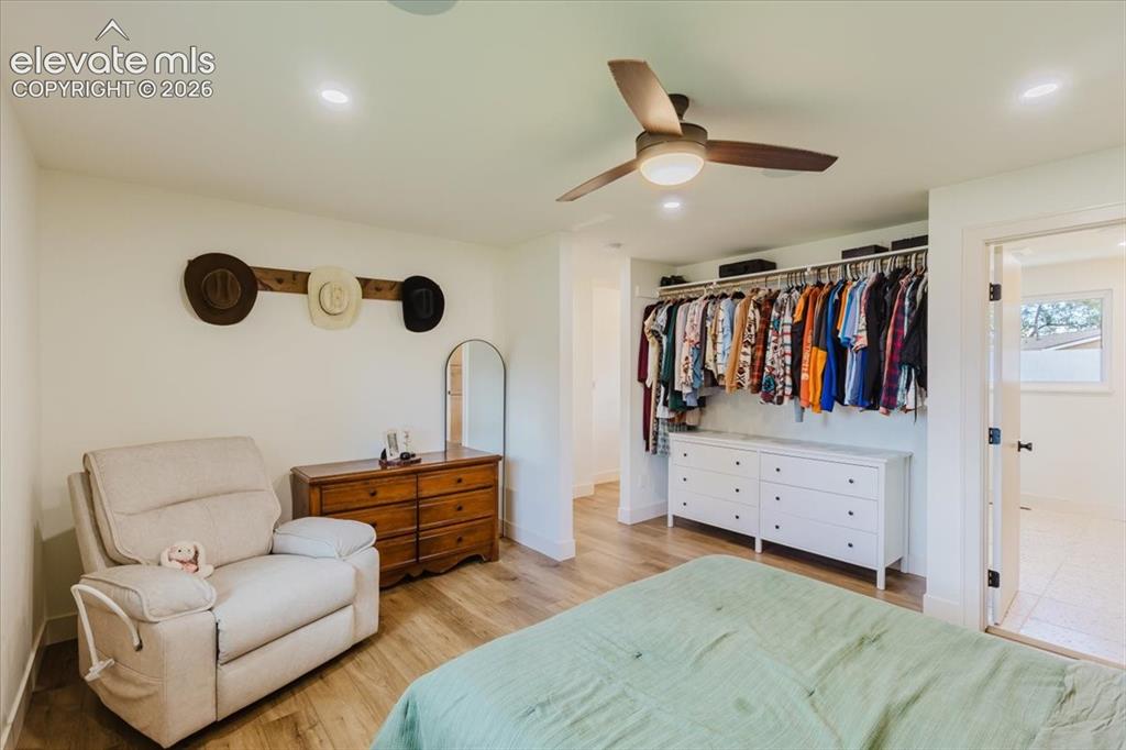 Image 38 of 49: Bedroom featuring wood-finish flooring, recessed lighting, and a ceiling fa