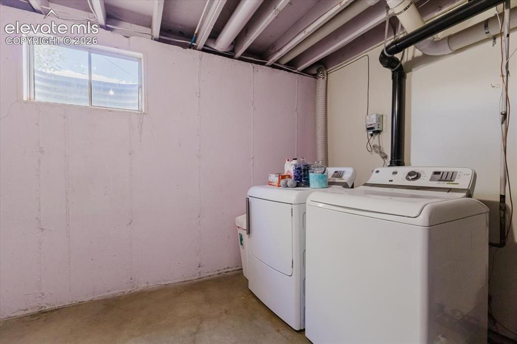 Image 49 of 49: Dedicated laundry area featuring a washer and dryer