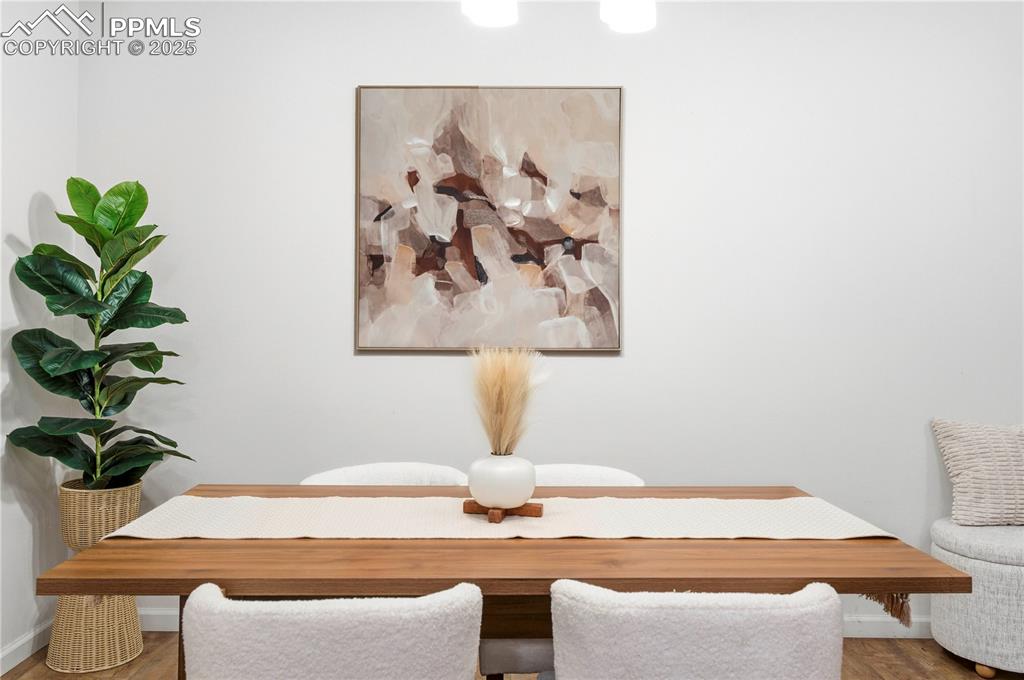 Image 9 of 31: Dining area with wood finished floors
