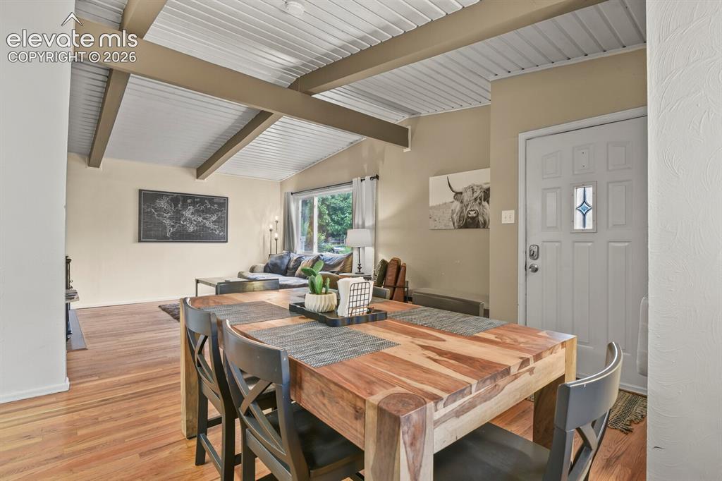 Image 10 of 37: Kitchen looking toward primary bedroom door and hallway to second bedroom a