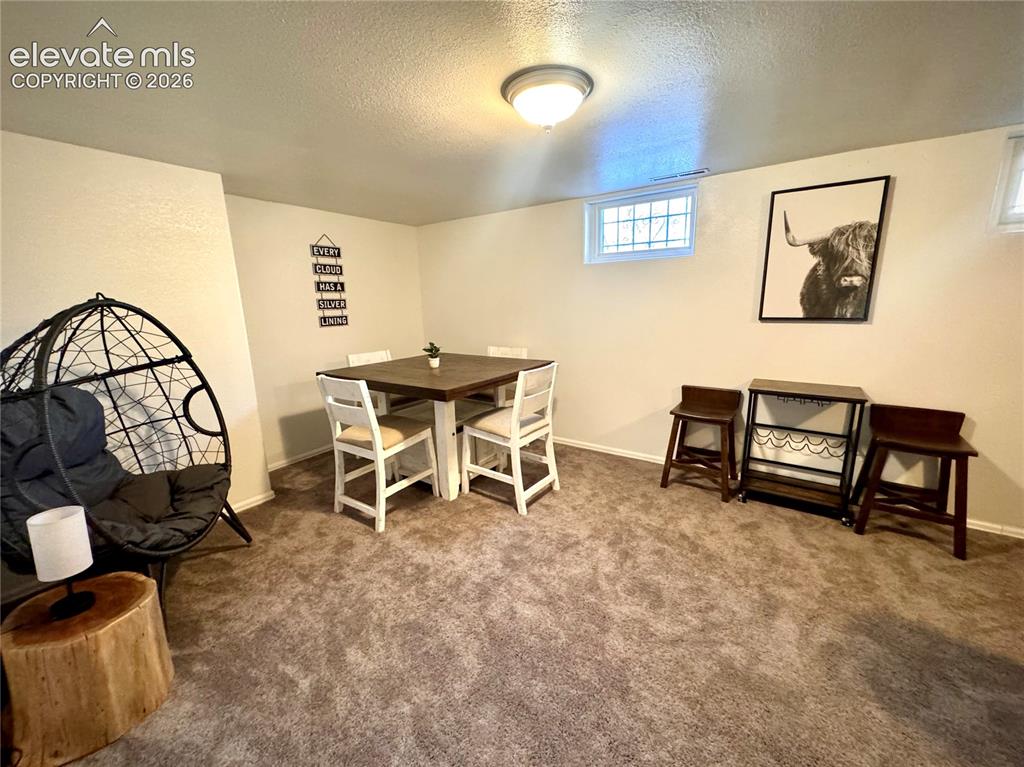 Image 12 of 30: Family Room eating area, Basement.