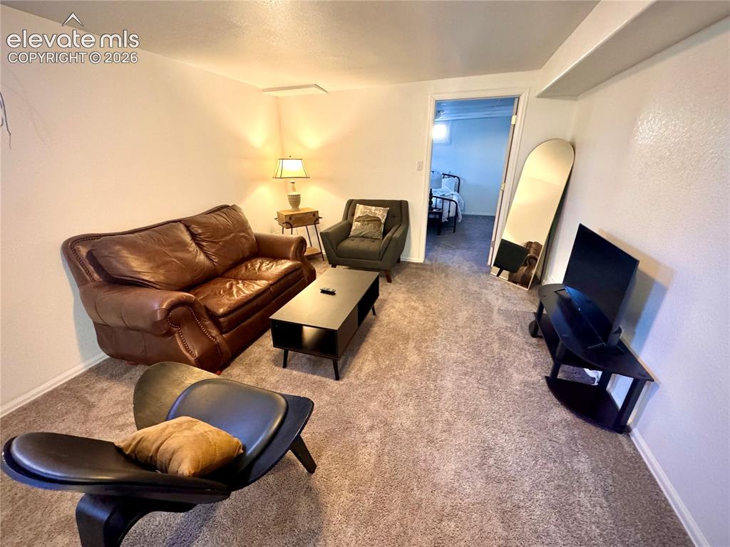 Image 13 of 30: Family Room Sitting Area, Basement