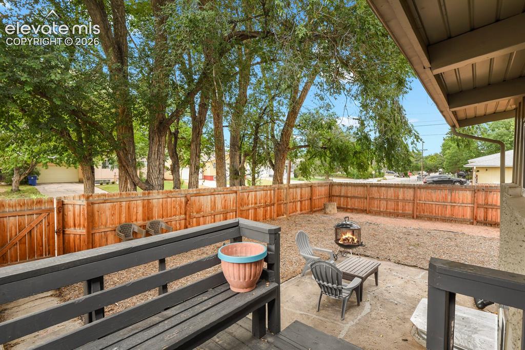 Image 34 of 37: Picture of the backyard from the back corner of the fence.
