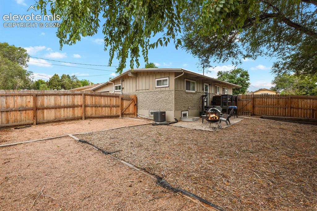 Image 36 of 37: View of front and side yard. Fully fenced front and back yard.