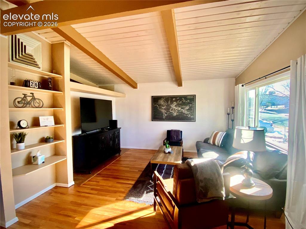 Image 4 of 30: Living room off the dining area, main floor.