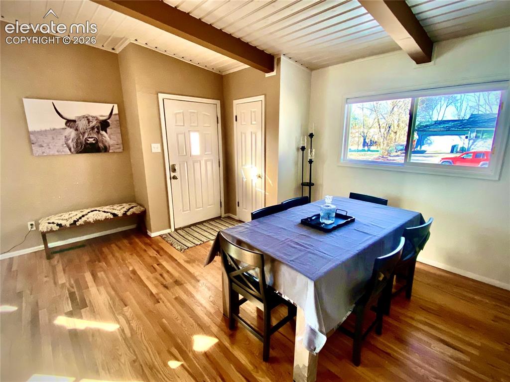 Image 5 of 30: Dining area looking toward the main entrance.