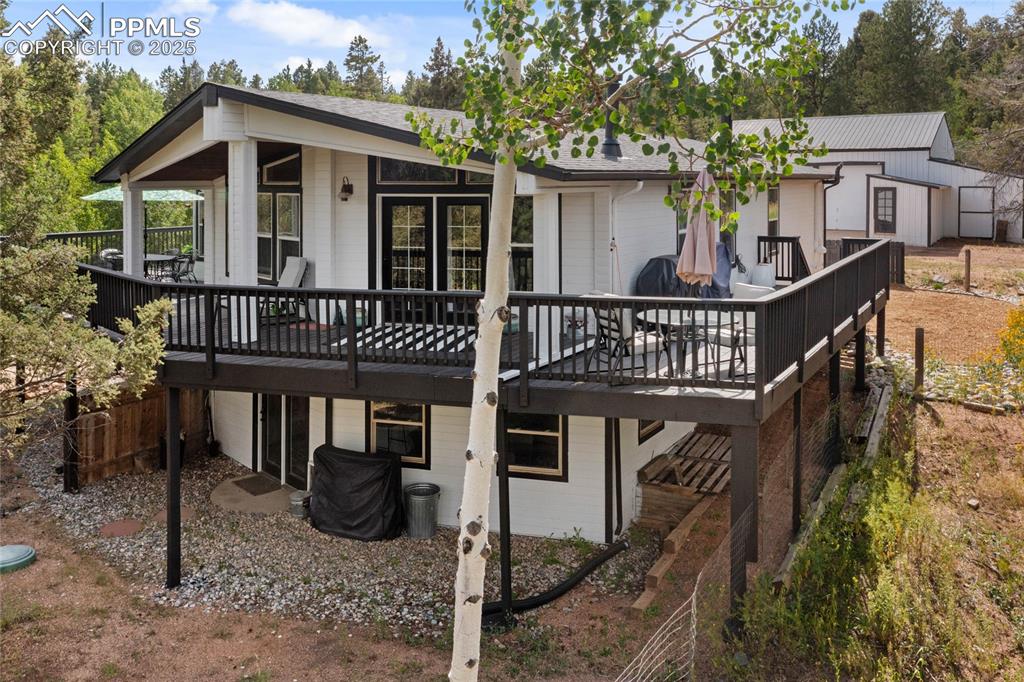 Caption: Rear view of property with a deck