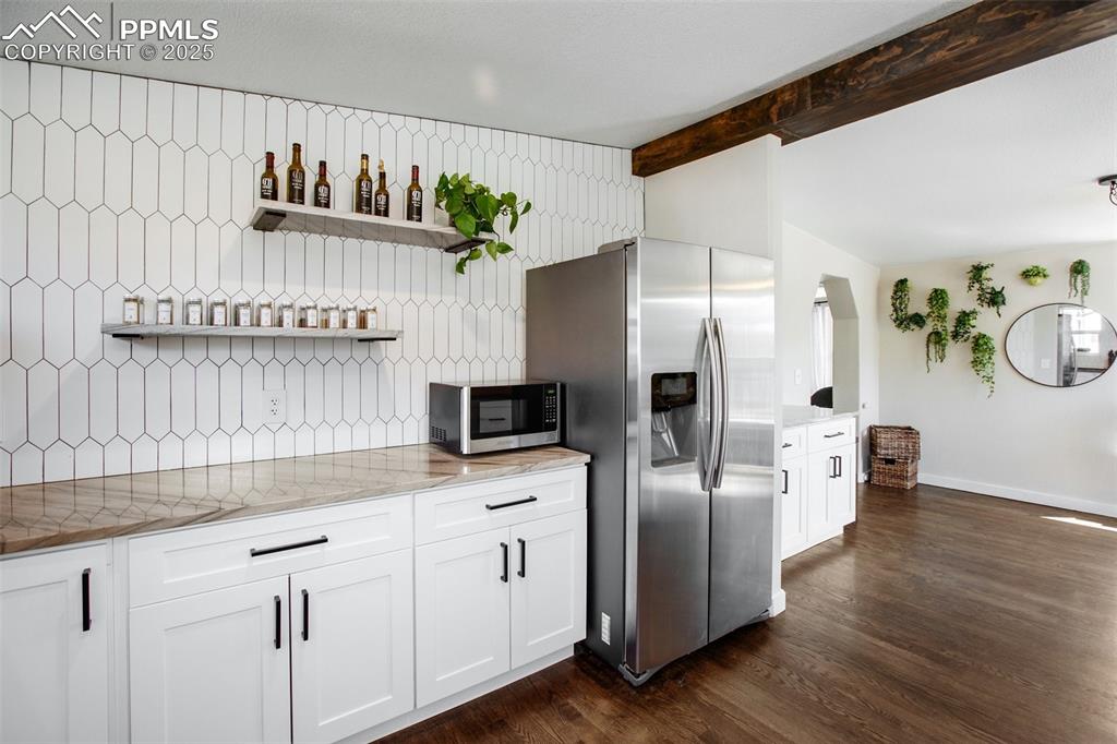 Image 14 of 50: Kitchen with stainless appliances