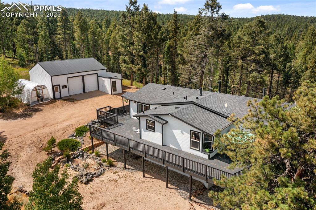 Image 2 of 50: View of subject property featuring a heavily wooded area