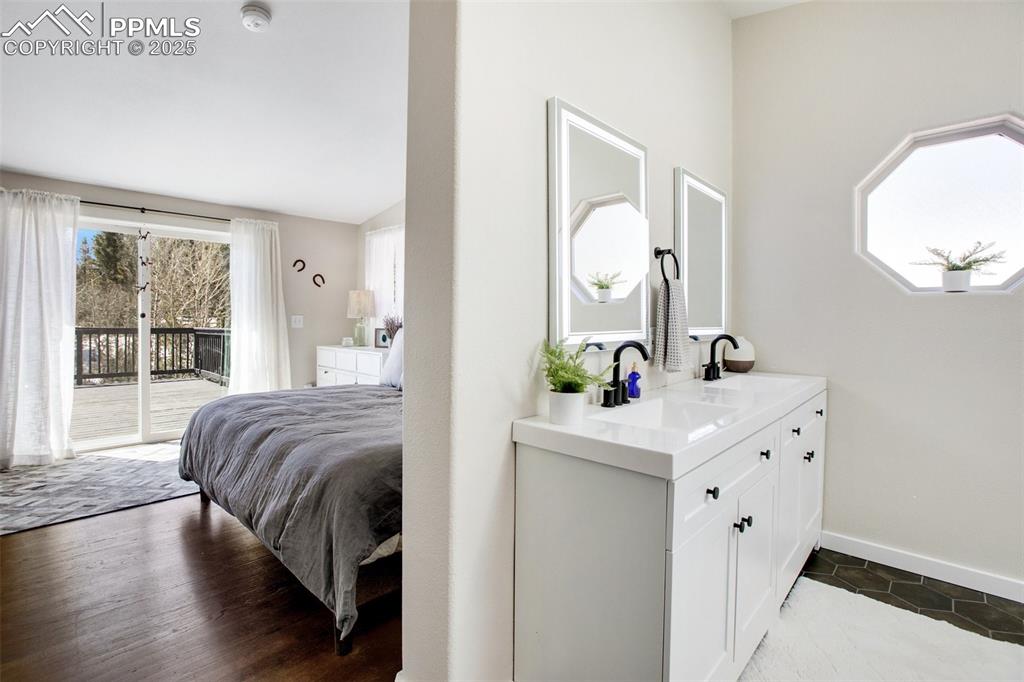 Image 21 of 50: Primary ensuite bathroom with double vanities