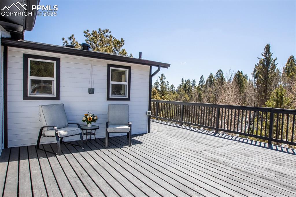 Image 35 of 50: Large sunny south-facing deck