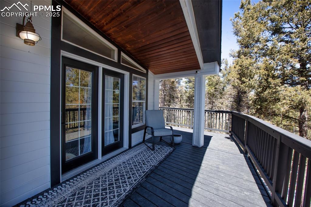Image 38 of 50: Main, upper floor entry off wraparound deck