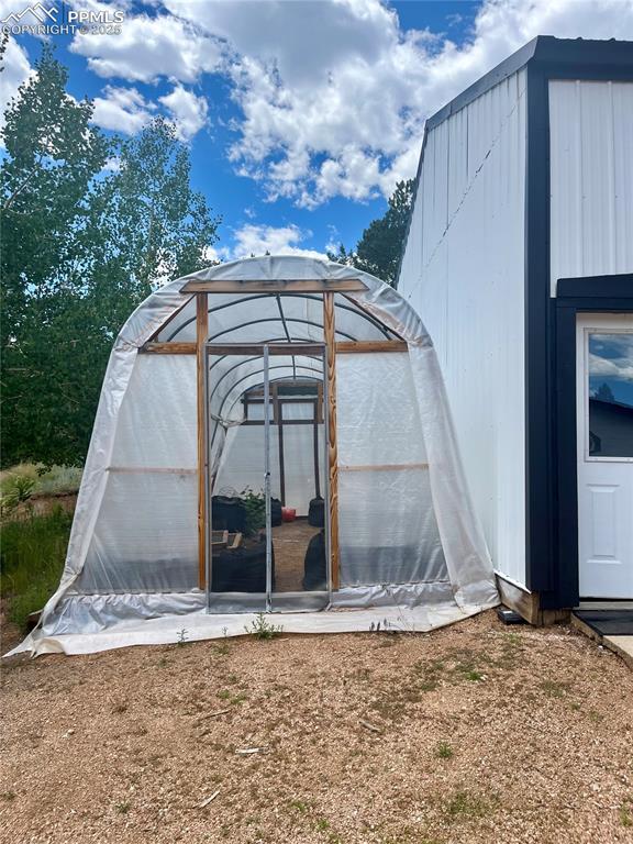 Image 41 of 50: Greenhouse included