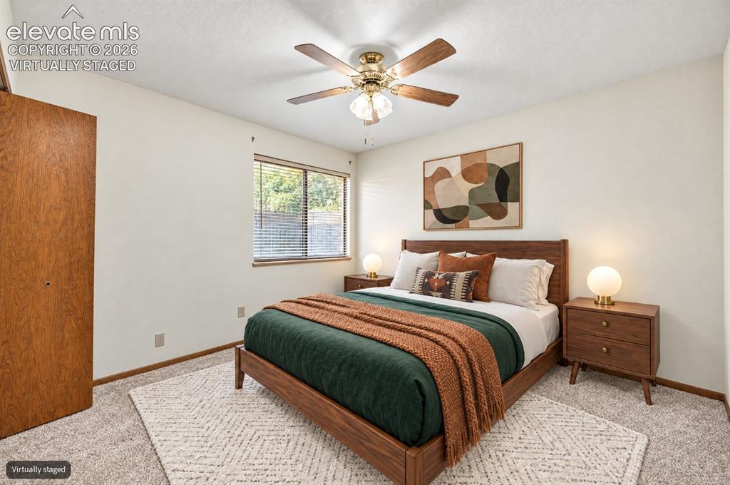 Image 9 of 23: Virtually Staged Warm room featuring a window with horizontal blinds, a woo