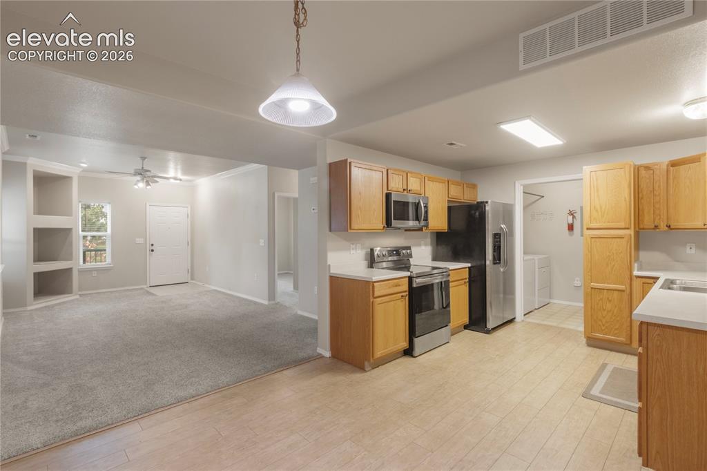 Image 13 of 45: Kitchen / Dining / Living Room and entrance