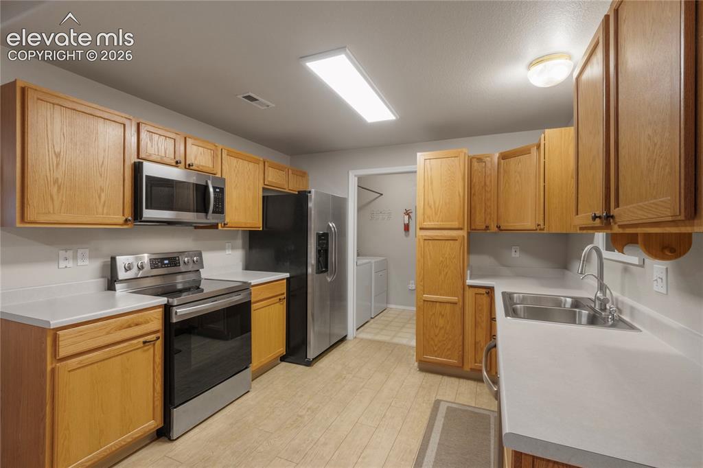 Image 14 of 45: Full Kitchen seen From Dining Area