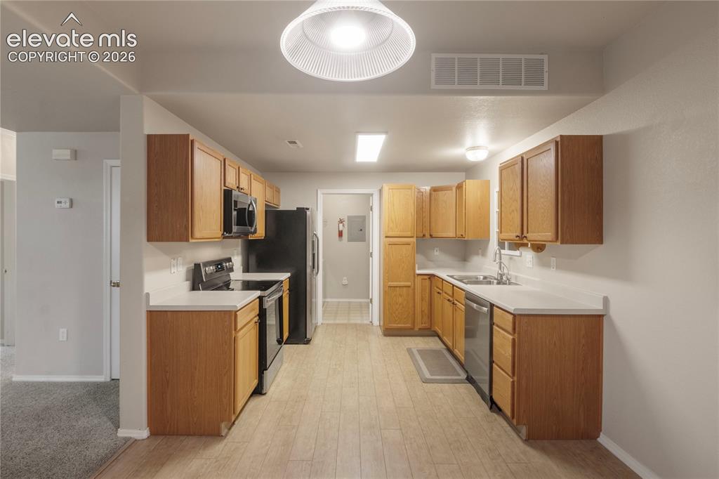 Image 20 of 45: Straight shot of Kitchen from Dining Area